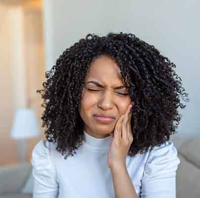 Woman experiencing tooth pain