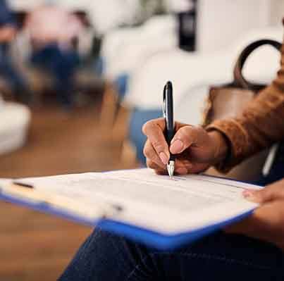 Person filling out paperwork