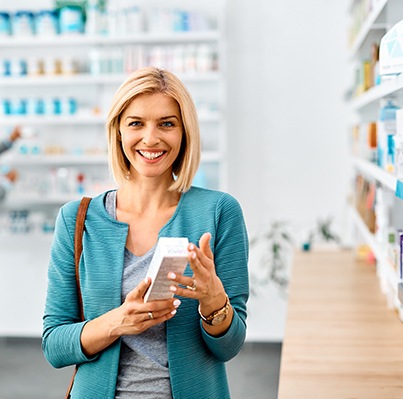 Patient in Oklahoma City looking at teeth whitening products